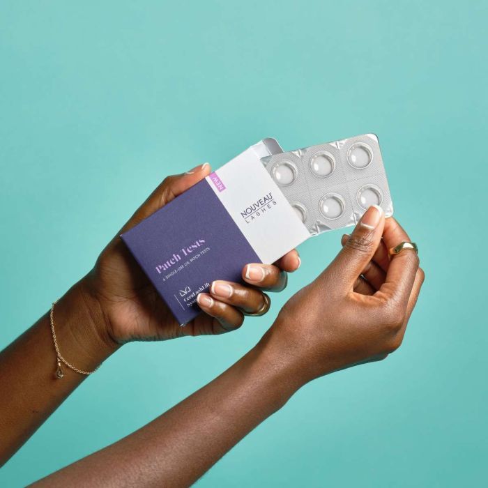 Hands opening the LVL CeraLashLift Patch Test Kit