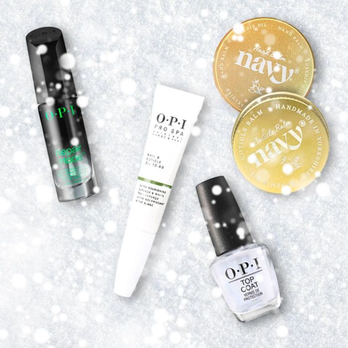 Flatlay of OPI and Navy nail products on a snowy background